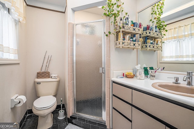 bathroom featuring tile patterned flooring, a shower with door, vanity, and toilet