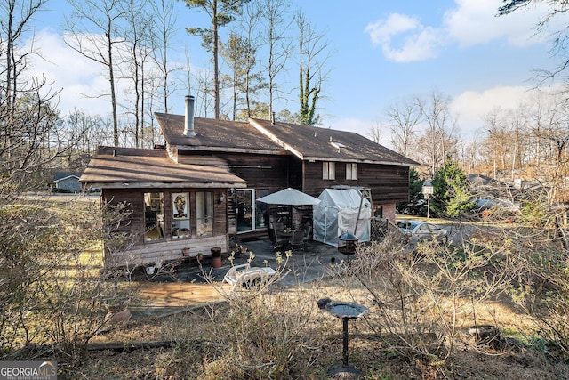 rear view of property with a patio