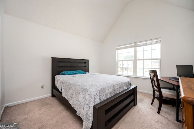 bedroom with baseboards, light colored carpet, and high vaulted ceiling