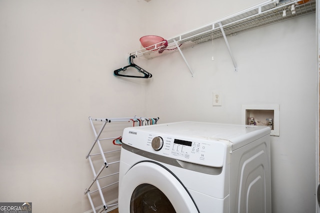 laundry room with laundry area and washer / dryer