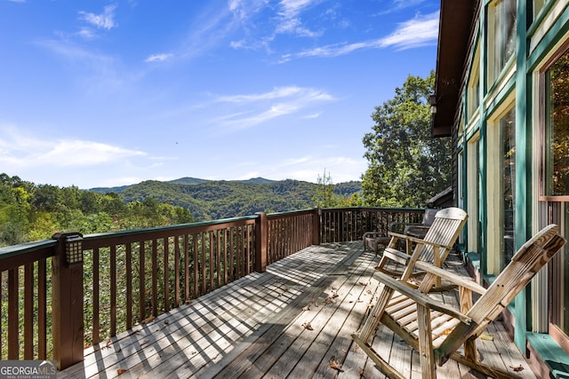 wooden terrace with a mountain view