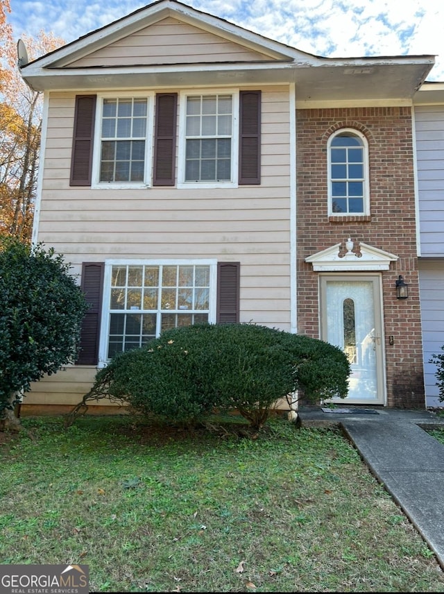 view of front of home with a front yard