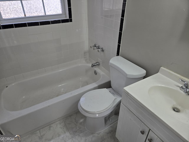 full bathroom featuring bathtub / shower combination, vanity, and toilet