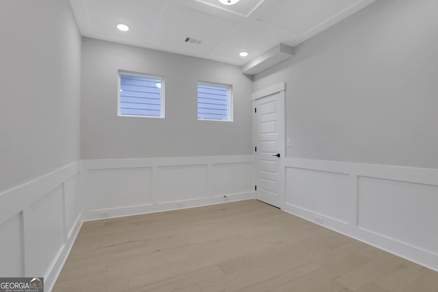 unfurnished room with light wood-type flooring