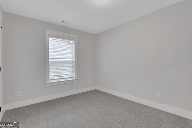 spare room featuring carpet floors