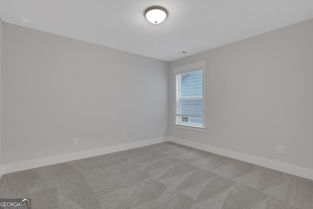 empty room with light colored carpet