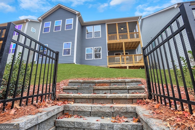 rear view of property with a lawn