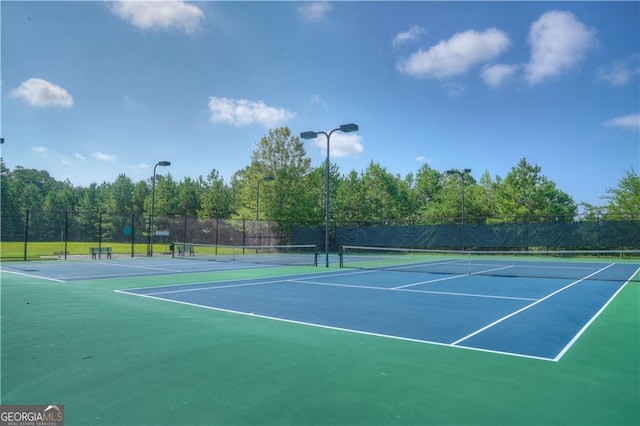 view of tennis court with basketball court