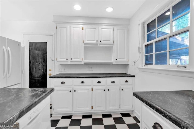 kitchen with a healthy amount of sunlight, white cabinetry, and white refrigerator