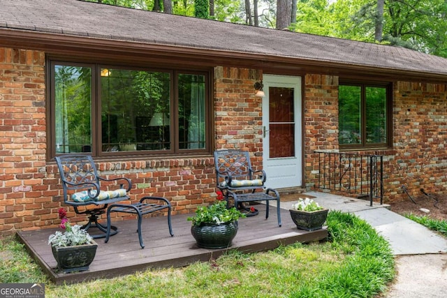 doorway to property with a wooden deck