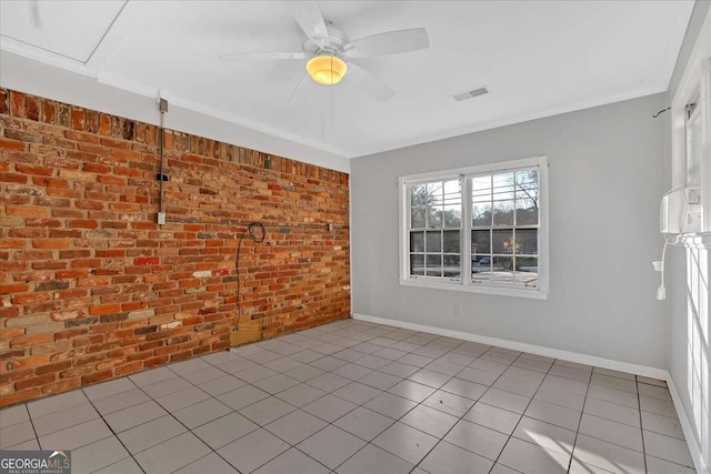 empty room featuring ceiling fan, light tile patterned floors, and brick wall