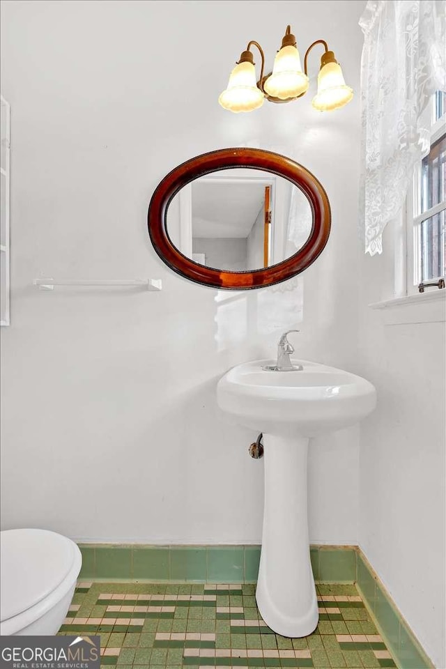 bathroom with tile patterned floors and toilet