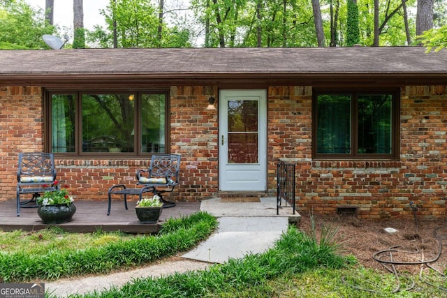 doorway to property with a deck