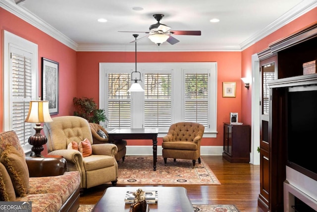 living room featuring ceiling fan, ornamental molding, and dark wood-type flooring