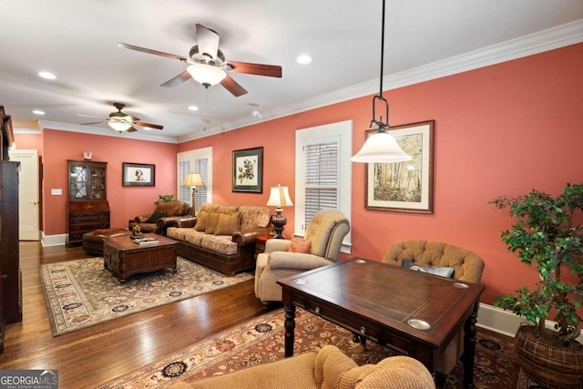 living room with hardwood / wood-style floors, ceiling fan, and crown molding