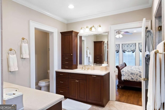 bathroom with crown molding, tile patterned flooring, vanity, and ceiling fan