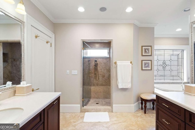 bathroom featuring tile patterned floors, vanity, crown molding, and tiled shower