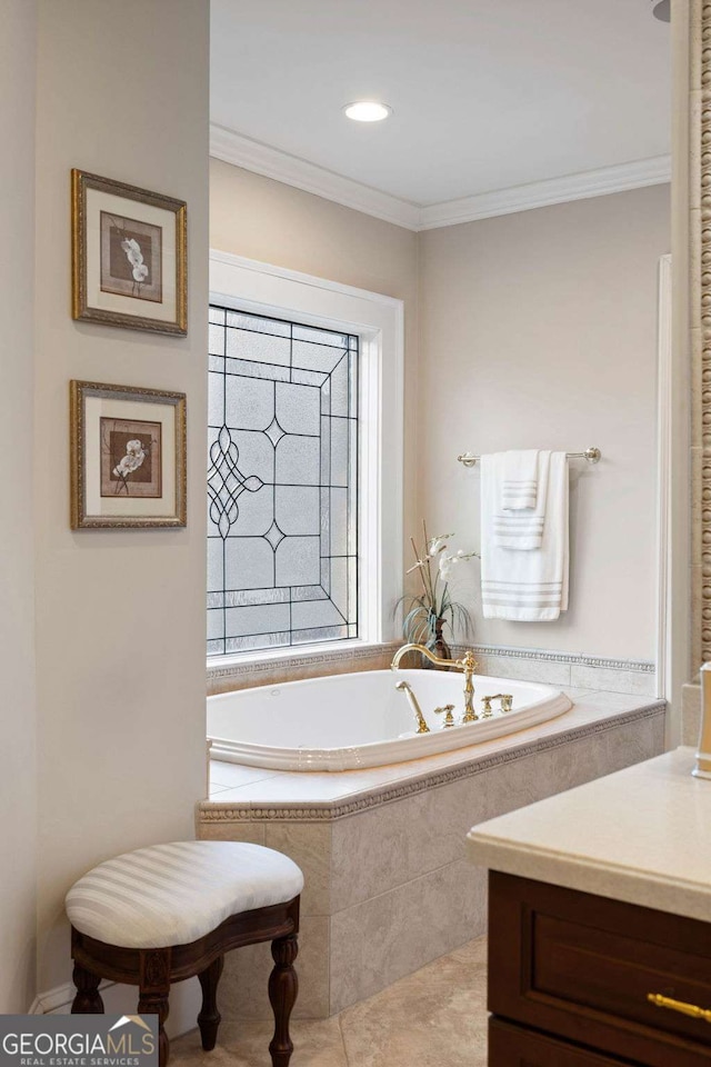 bathroom with vanity, a relaxing tiled tub, tile patterned floors, and ornamental molding