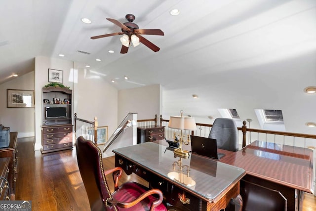 dining space featuring ceiling fan, dark hardwood / wood-style flooring, and vaulted ceiling