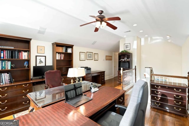 office featuring dark hardwood / wood-style floors, vaulted ceiling, and ceiling fan