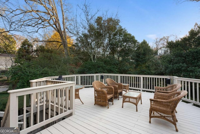 wooden terrace featuring an outdoor hangout area