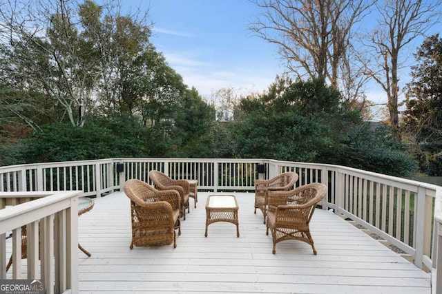 wooden deck featuring an outdoor hangout area