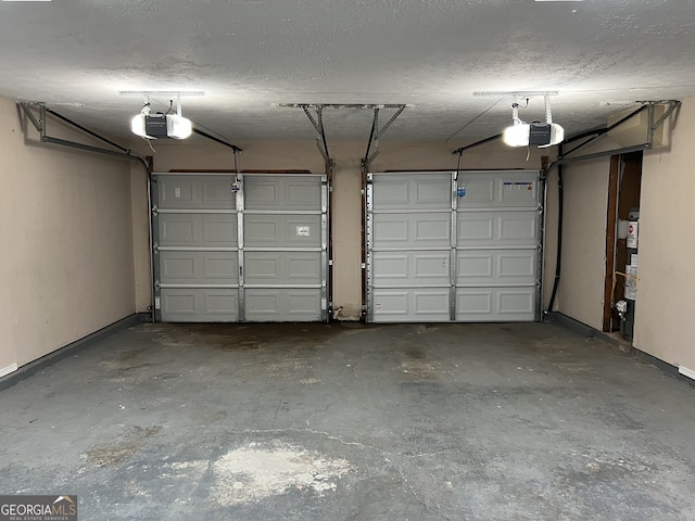 garage with a garage door opener and water heater