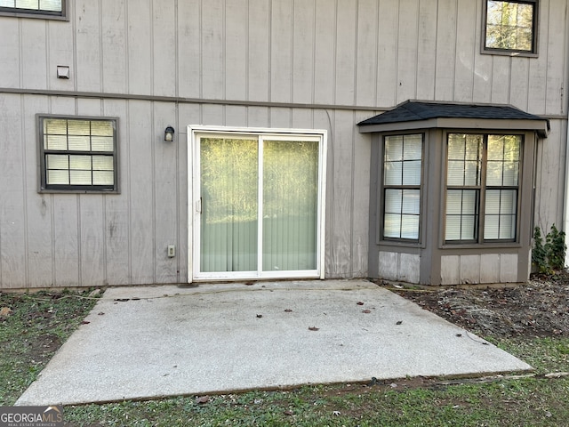 property entrance featuring a patio area