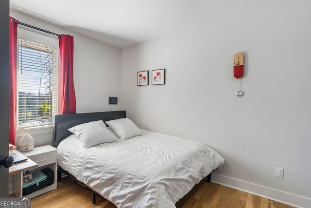 bedroom featuring hardwood / wood-style floors