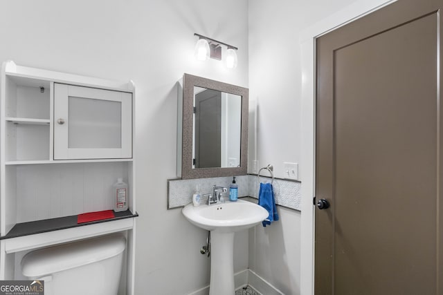 bathroom with toilet and sink