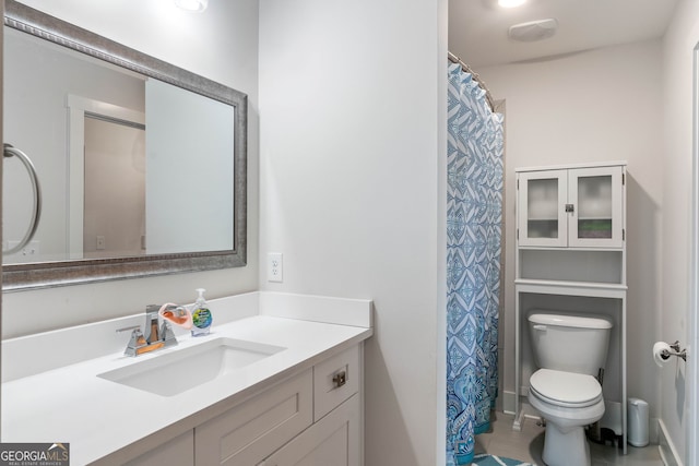 bathroom with vanity and toilet