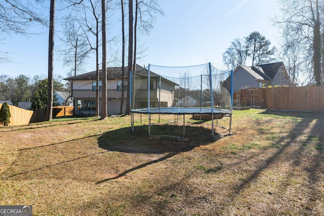 view of yard with a trampoline