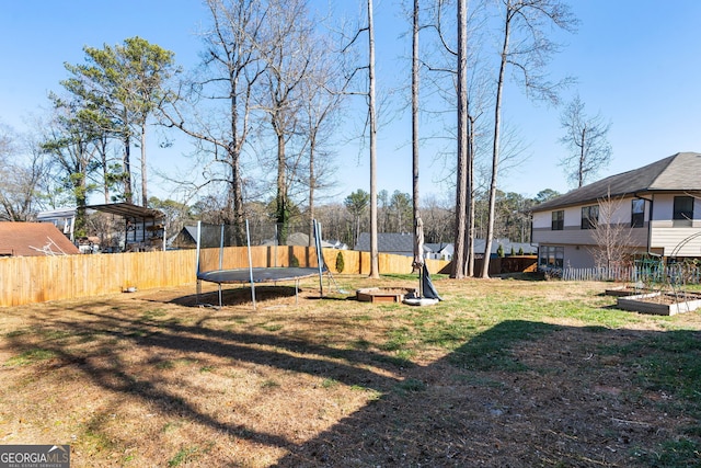 view of yard featuring a trampoline