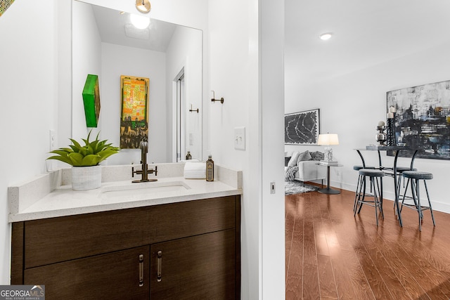 bathroom with vanity and wood-type flooring