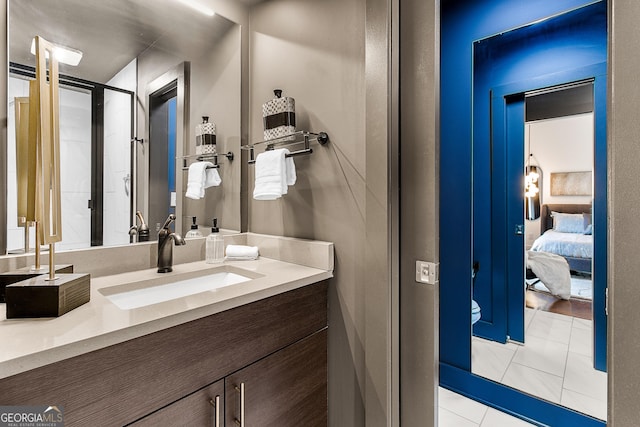 bathroom with tile patterned flooring and vanity