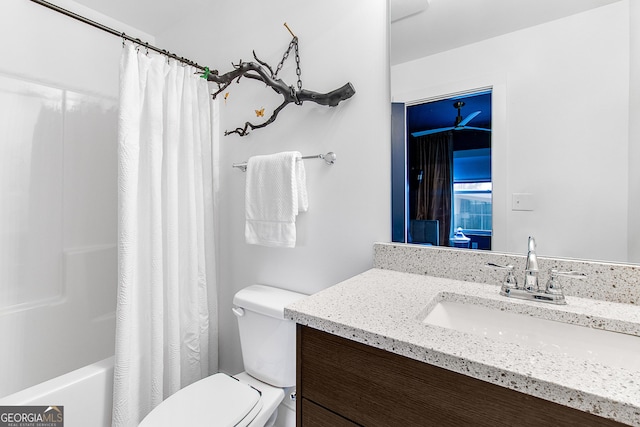 full bathroom with vanity, shower / bathtub combination with curtain, and toilet