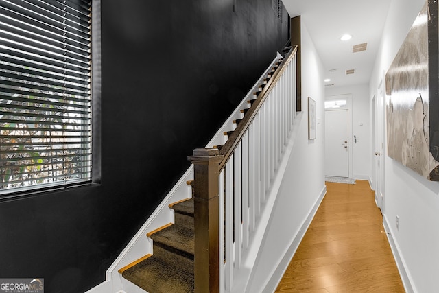 staircase featuring hardwood / wood-style flooring