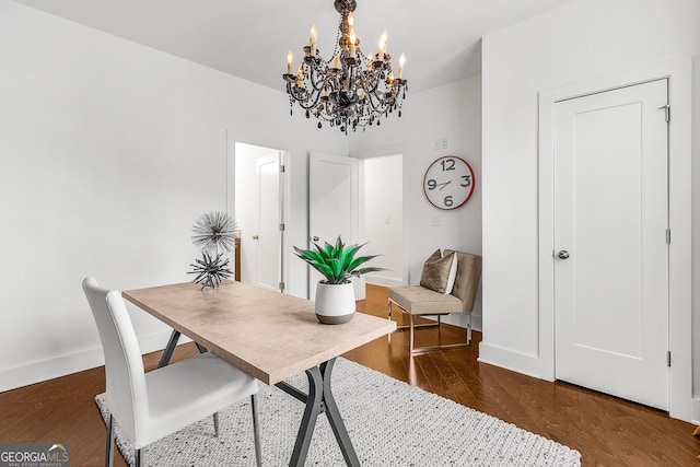 office space with dark hardwood / wood-style flooring and a chandelier