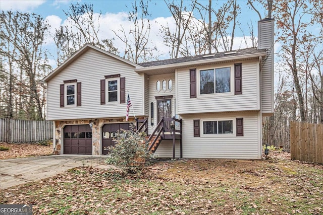 split foyer home featuring a garage