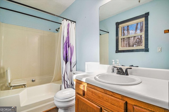 full bathroom with shower / bathtub combination with curtain, vanity, and toilet