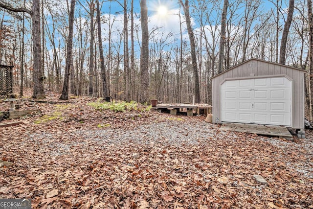 view of yard with an outbuilding and a garage