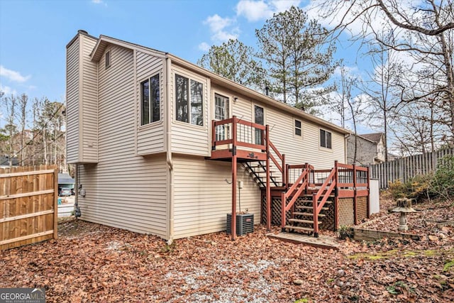 rear view of house with a wooden deck