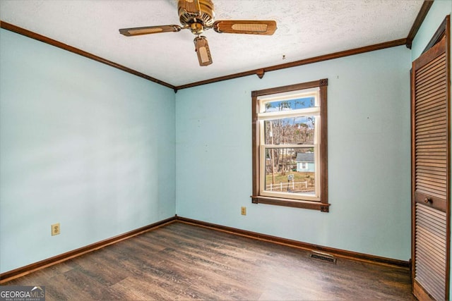 unfurnished bedroom featuring dark hardwood / wood-style flooring, ceiling fan, a closet, and a textured ceiling