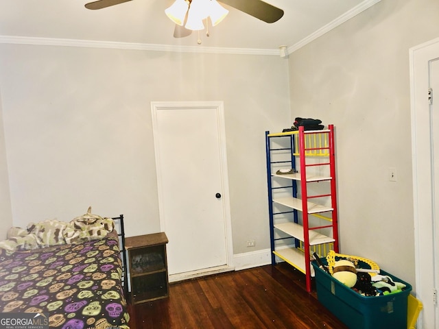 bedroom with ceiling fan, dark wood-type flooring, and ornamental molding