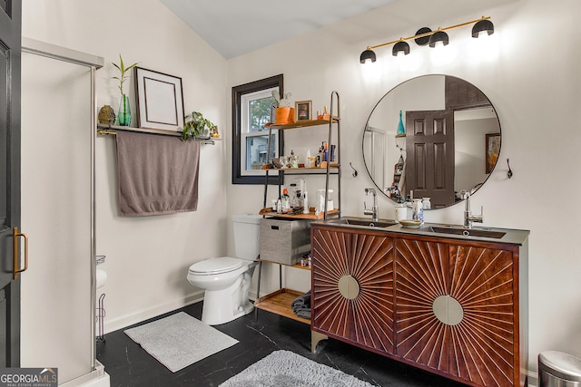 bathroom featuring vanity, lofted ceiling, and toilet