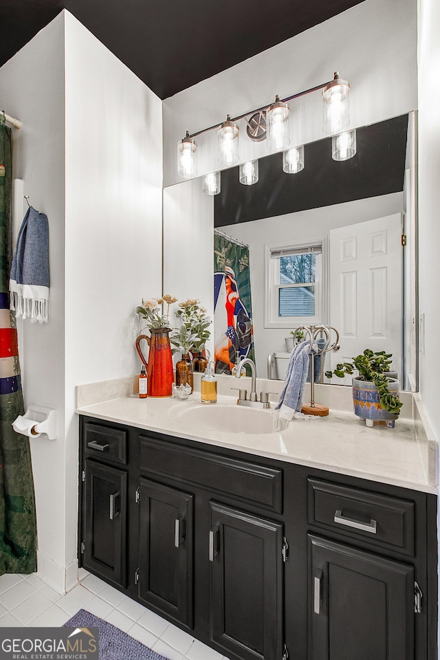 bathroom with tile patterned floors and vanity