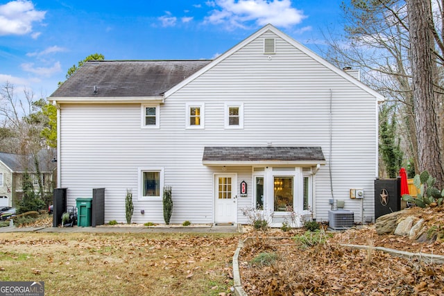 rear view of property featuring central air condition unit