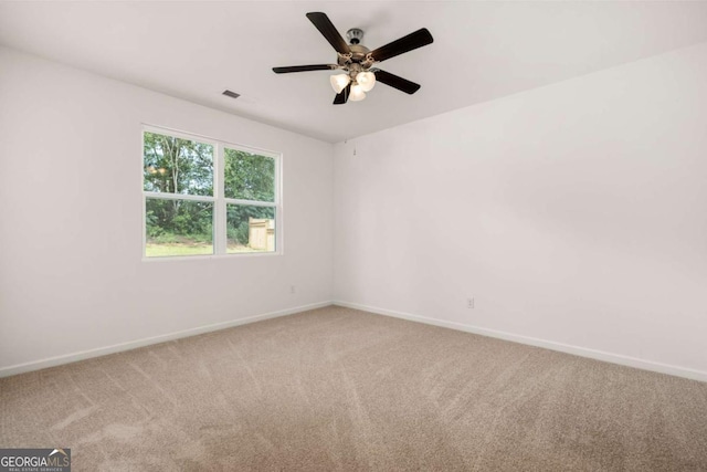 carpeted empty room with ceiling fan