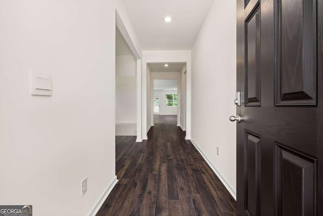 hallway featuring dark wood-type flooring