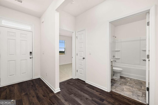 entryway with dark wood-type flooring